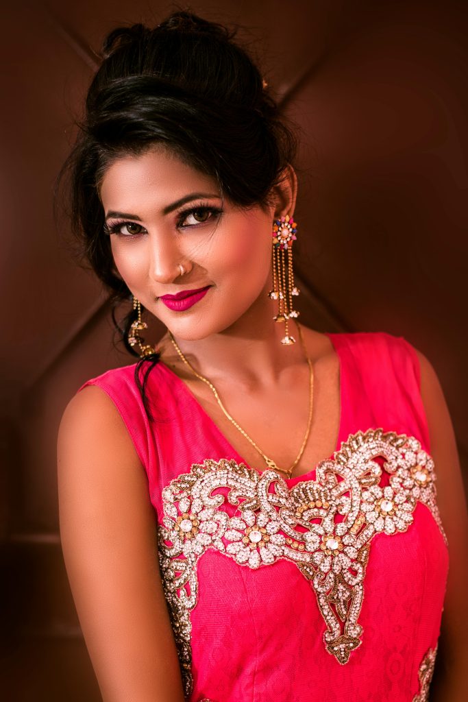 Beautiful portrait of a woman in intricate traditional attire, exuding elegance and charm.